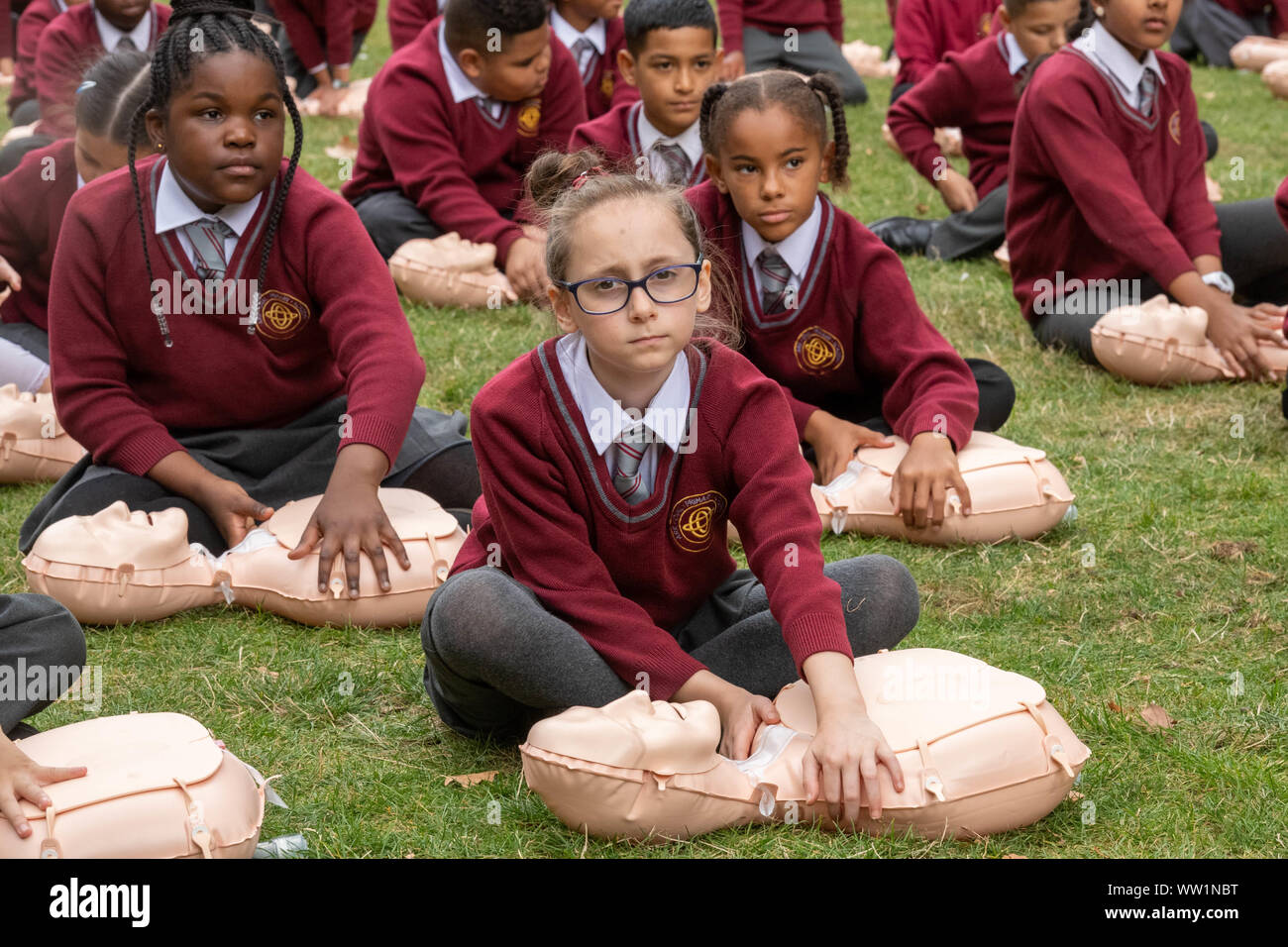London UK, 12th September 2019 The British Red Cross hosts a demonstration  of 100 school children conducting first aid outside the Houses of  Parliament to mark the achievement of getting first aid