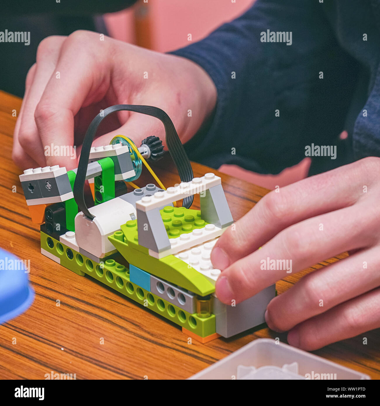 The boy makes a car model from the details of the children's designer Stock Photo
