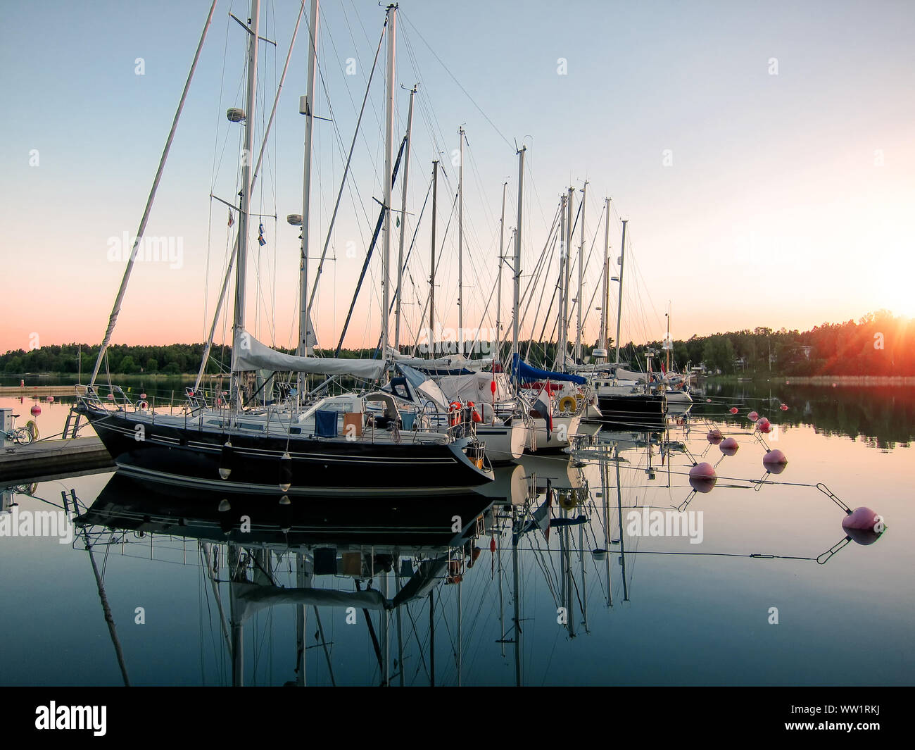 Small boat marina in warm summer evening at Åland, Finland. Stock Photo