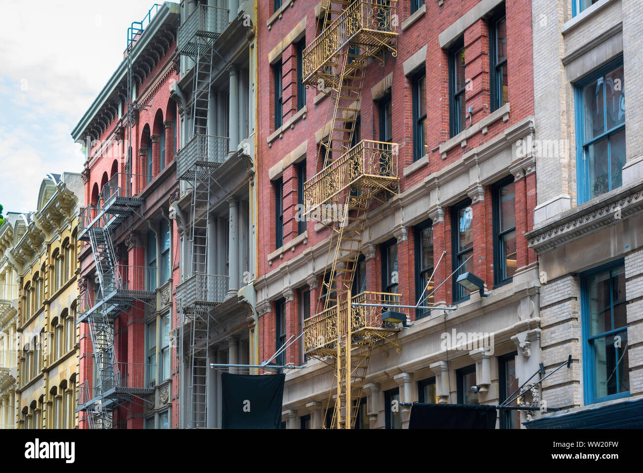 Soho New York, view of typical apartment buildings with street-facing fire escapes in the Cast Iron District of Soho, downtown New York City, USA Stock Photo