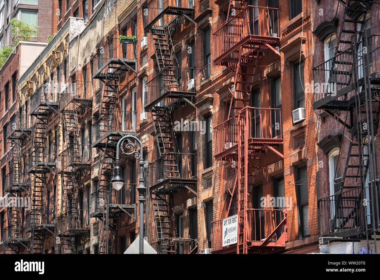 New York architecture, view of typical New York 19th century buildings with fire escape ladders attached, Lower East Side street, New York City, USA Stock Photo