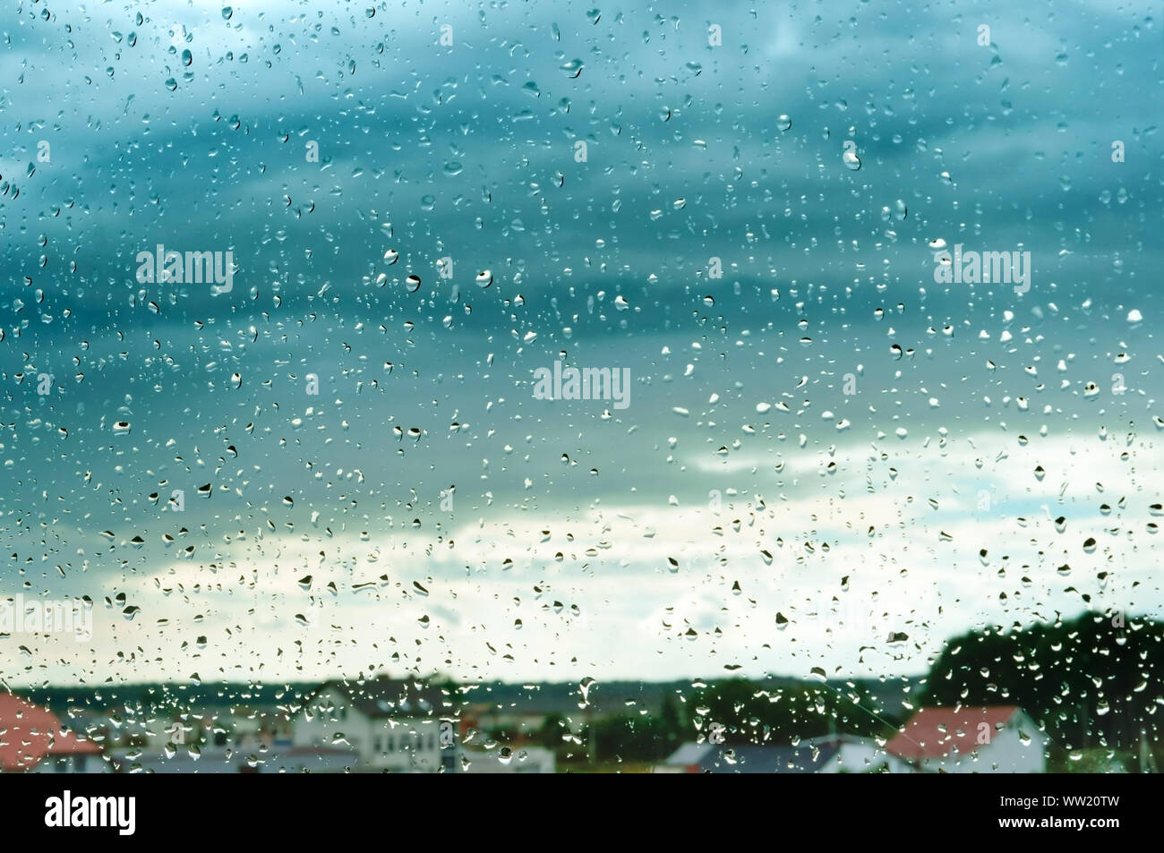 rain and clouds outside the window, raindrops on the window Stock Photo