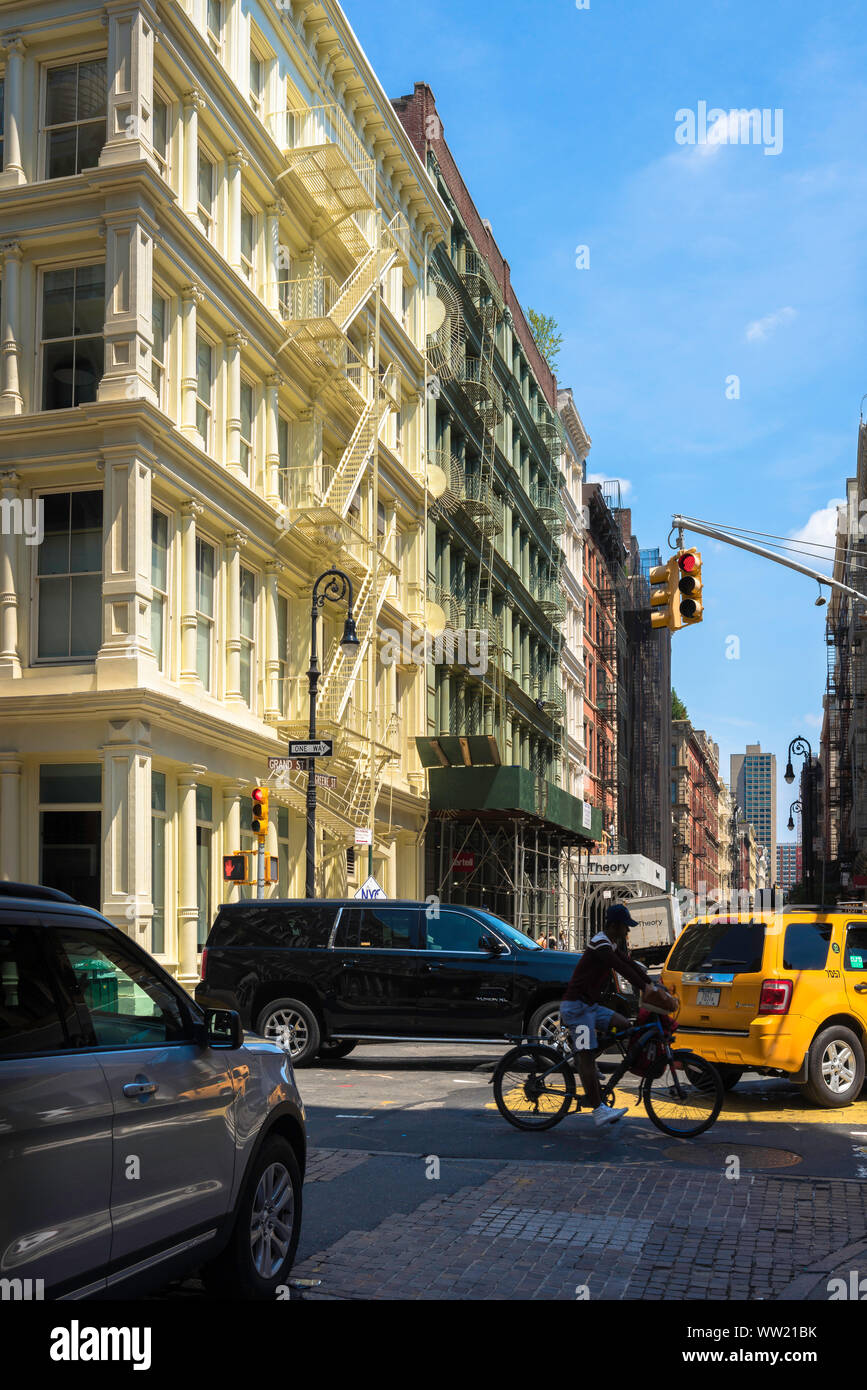 New York Cast Iron District, view in summer of traffic crossing Green Street in the Soho Cast Iron district of downtown Manhattan, New York City, USA Stock Photo