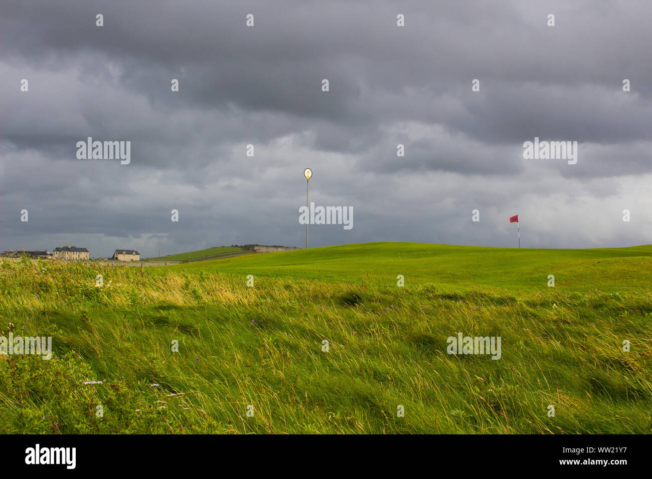 22 Augusrt 2019 The 8th hole and on Bundoran Golf Course  in County Donegal Ireland on a damp day with dark ominous storm clouds overhead. Stock Photo