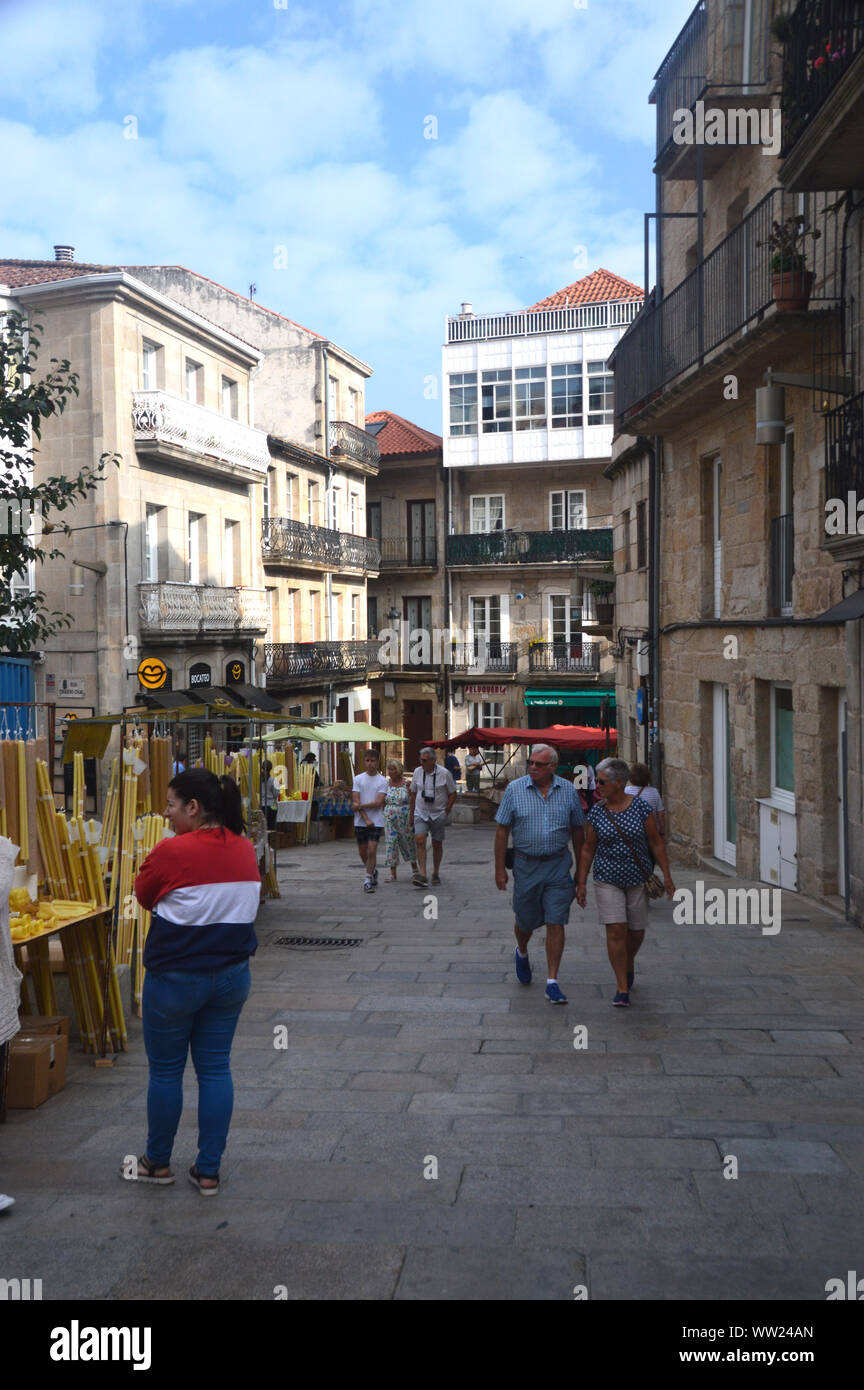 People Walking in the Street near the Collegiate Church of Saint Maria in the Old Town of Vigo, North West Spain, EU. Stock Photo