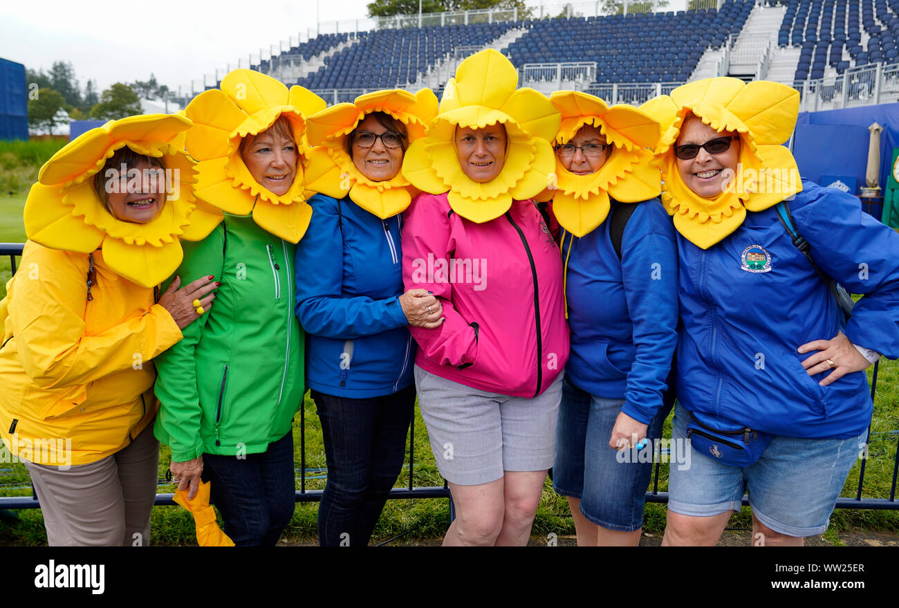 Auchterarder, Scotland, UK. 12 September 2019. Final practice day for the 2019 Solheim Cup before the official opening saw many patriotic fans arrive on the course at Gleneagles. Pictured; Welsh Team Europe women fans from Merthyr Tydfil in daffodil fancy dress. Iain Masterton/Alamy Live News Stock Photo