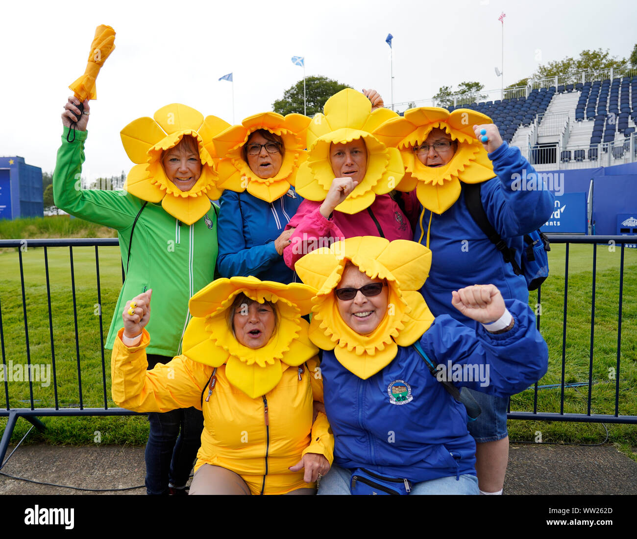 Auchterarder, Scotland, UK. 12 September 2019. Final practice day for the 2019 Solheim Cup before the official opening saw many patriotic fans arrive on the course at Gleneagles. Pictured; Welsh Team Europe women fans from Merthyr Tydfil in daffodil fancy dress. Iain Masterton/Alamy Live News Stock Photo