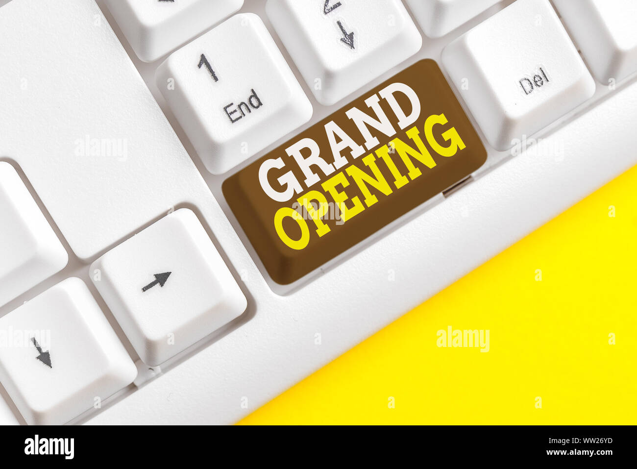 Word writing text Grand Opening. Business photo showcasing Ribbon Cutting New Business First Official Day Launching White pc keyboard with empty note Stock Photo