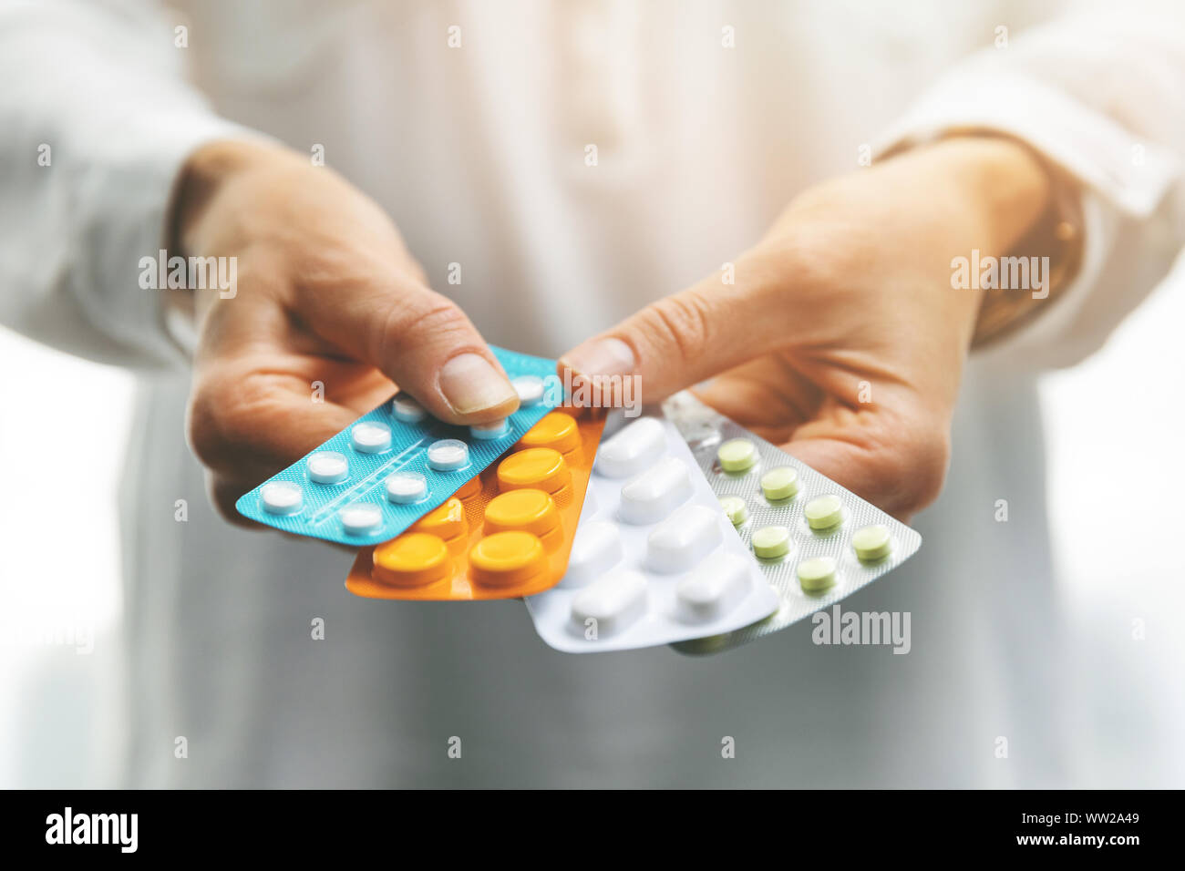 pharmacy - woman hands holding blister packs with pills Stock Photo