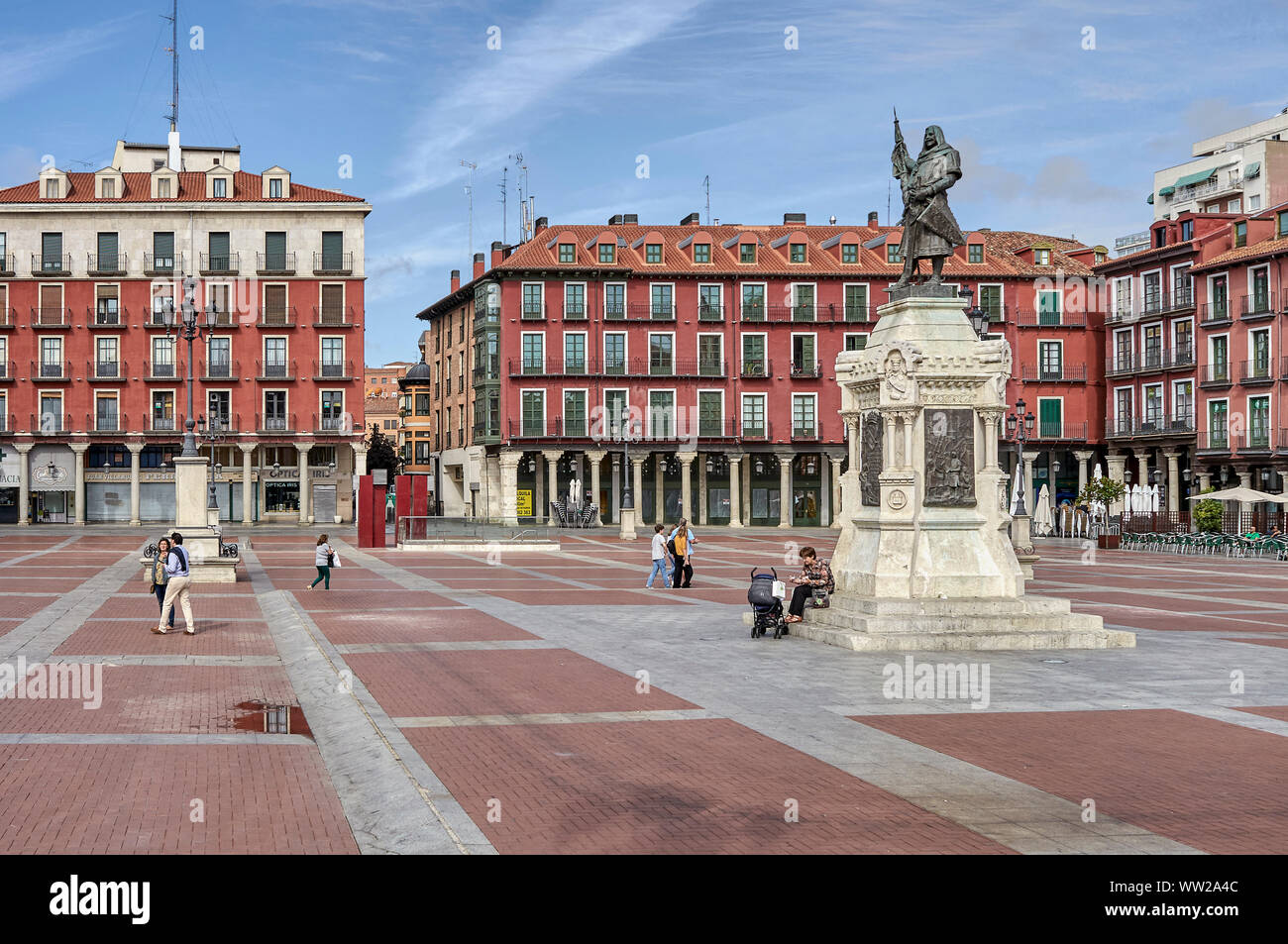 Statue of Count Ansurez founder of the city of Valladolid in the Plaza Mayor, with scenes of Quijote in bronze relief on the pedestal, Spain Stock Photo