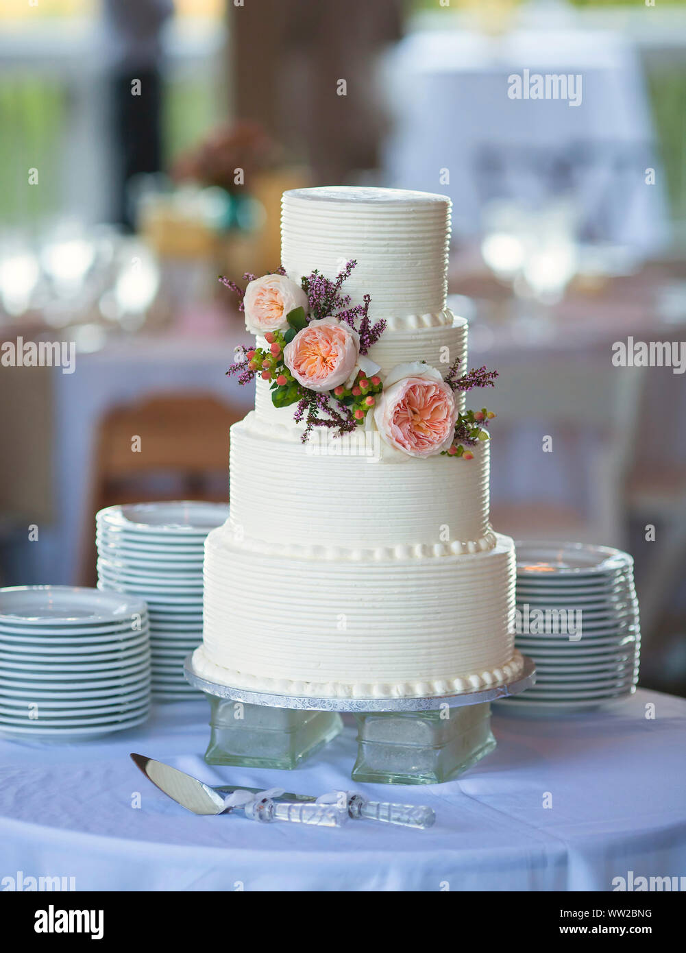 three tiered wedding cake with flowers Stock Photo - Alamy