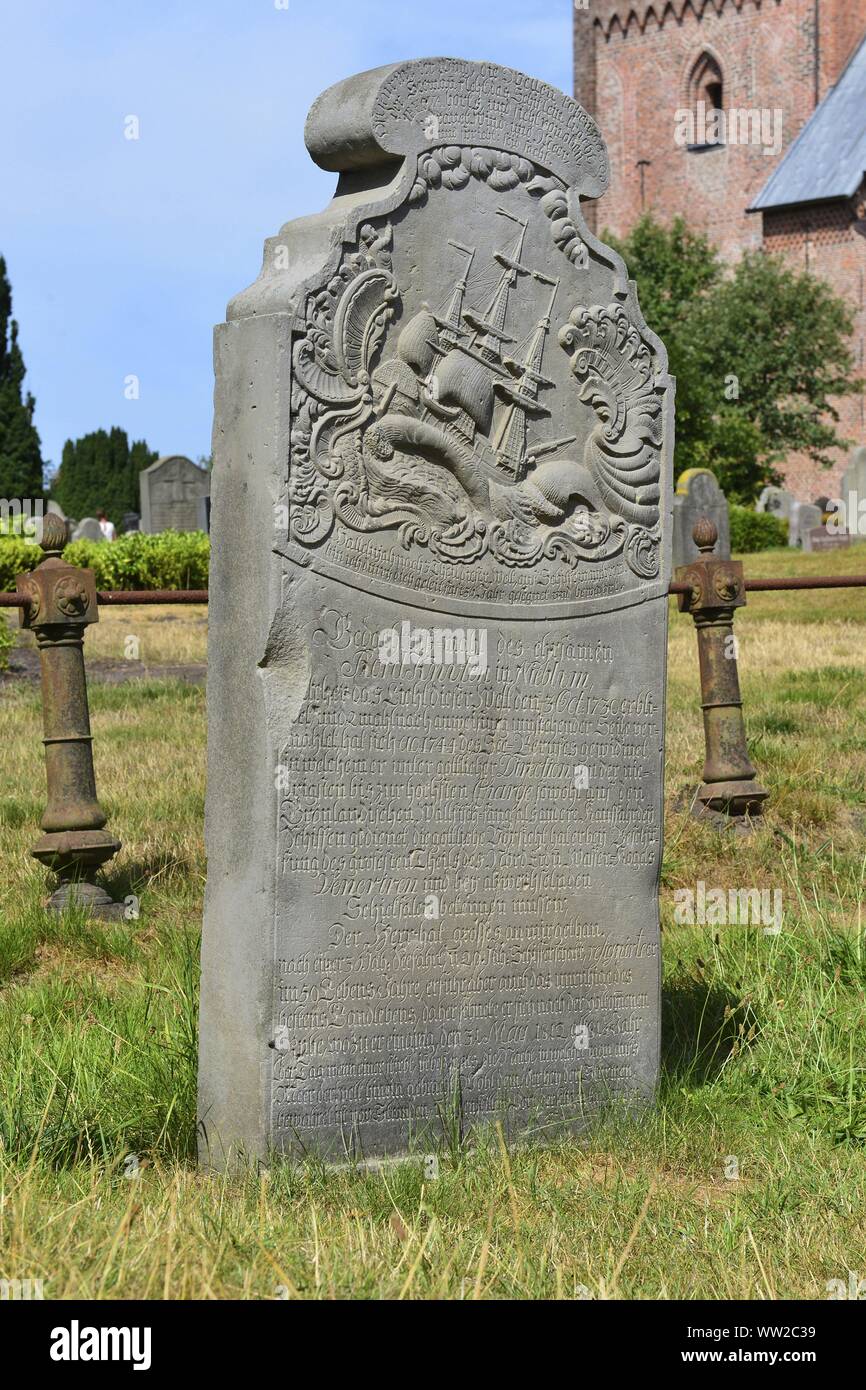 Historic tombstone from a sailor and whaler on the cemetery around the church Friesendom in Nieblum, 29 July 2018 | usage worldwide Stock Photo