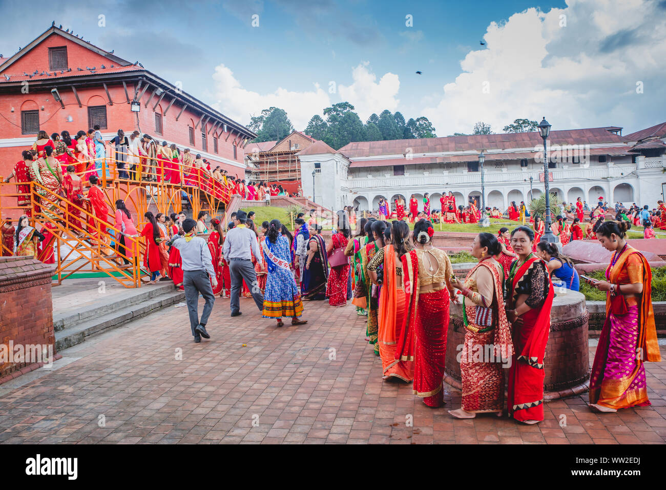 Kathmandu,Nepal - Sep 2,2019 : Large Group of Nepali Hindu Women waiting in line to worship at Pashupatinath Temple  on the occassion of Teej Festival Stock Photo