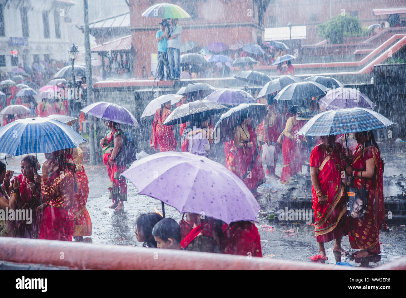 kathmandu,Nepal Sep 2,2019 Hindu women with umbrellas while raining at Pashupatinath temple