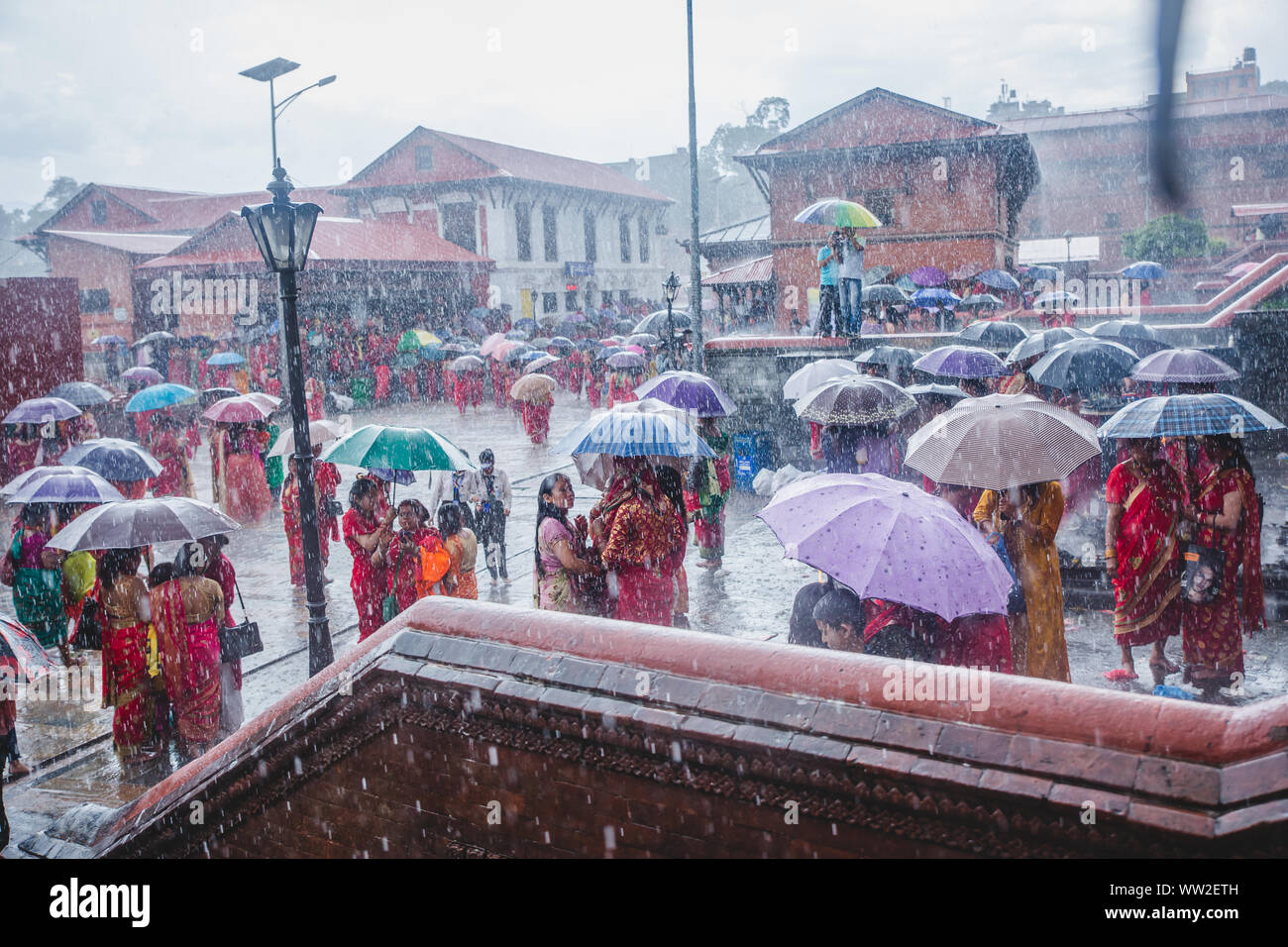 kathmandu,Nepal Sep 2,2019 Hindu women with umbrellas while raining at Pashupatinath temple