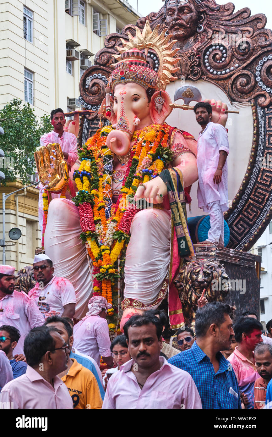 During the Ganesh Festival procession in Mumbai, India, worshippers of