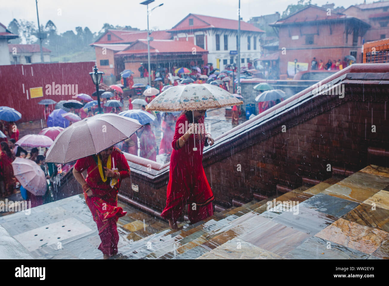 kathmandu,Nepal Sep 2,2019 Hindu women with umbrellas while raining at Pashupatinath temple