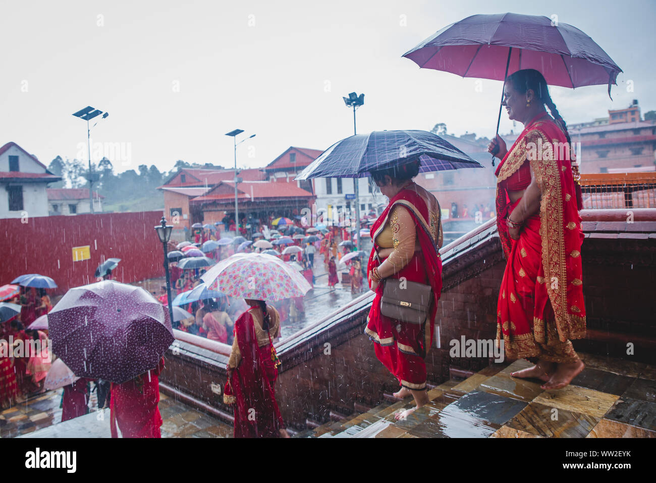 kathmandu,Nepal Sep 2,2019 Hindu women with umbrellas while raining at Pashupatinath temple