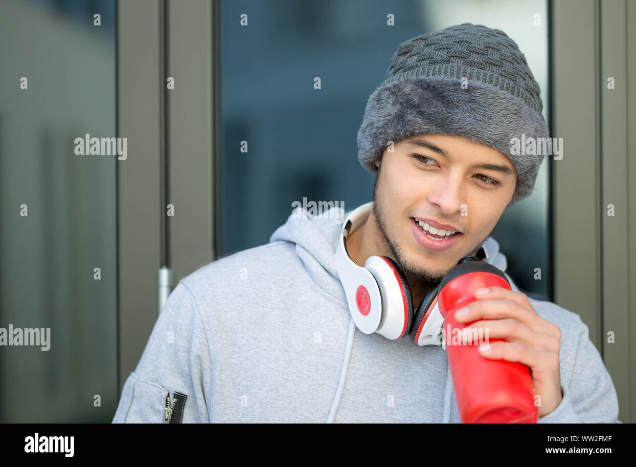 Sports training young latin man drinking runner copyspace copy space winter running fitness outdoor Stock Photo