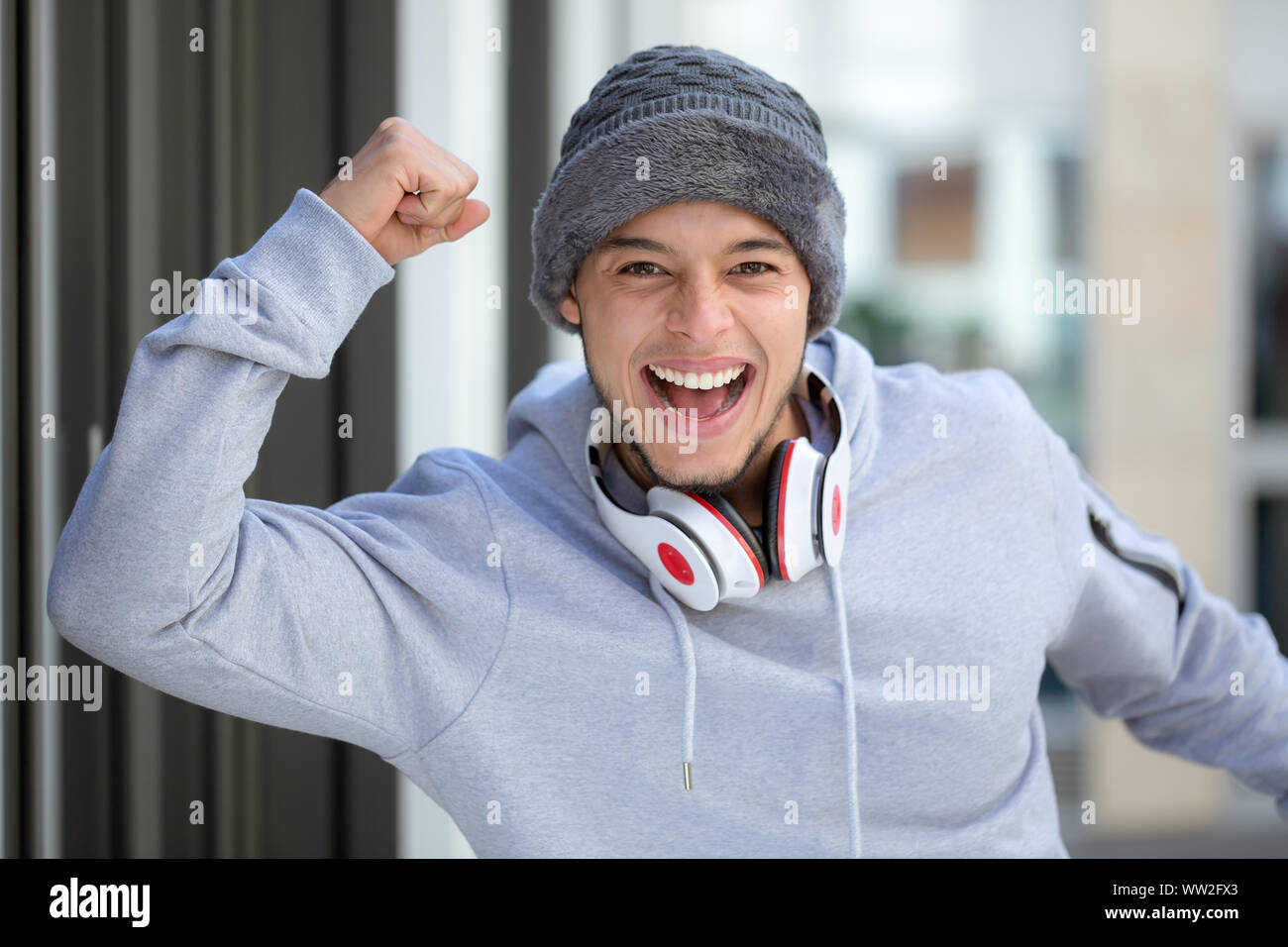 Successful happy young latin man runner jogger sport sports cold winter joy pleasure outdoor Stock Photo