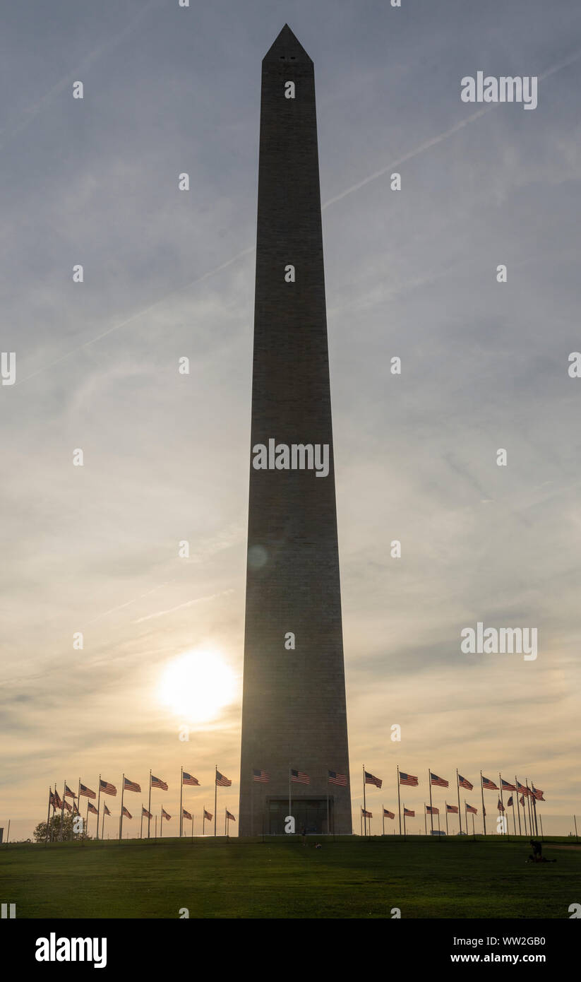 Washington Monument is silhouetted by the late afternoon sun on the National Mall in Washington, DC. Stock Photo