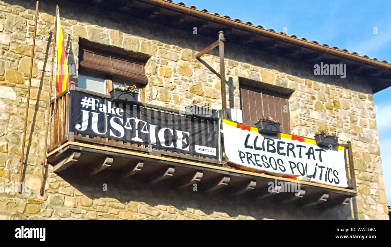 Catalan protest posters on the balcony of a stone house Stock Photo