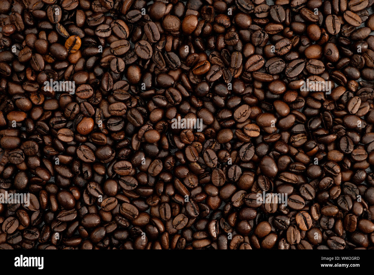 roasted coffee beans background Stock Photo - Alamy
