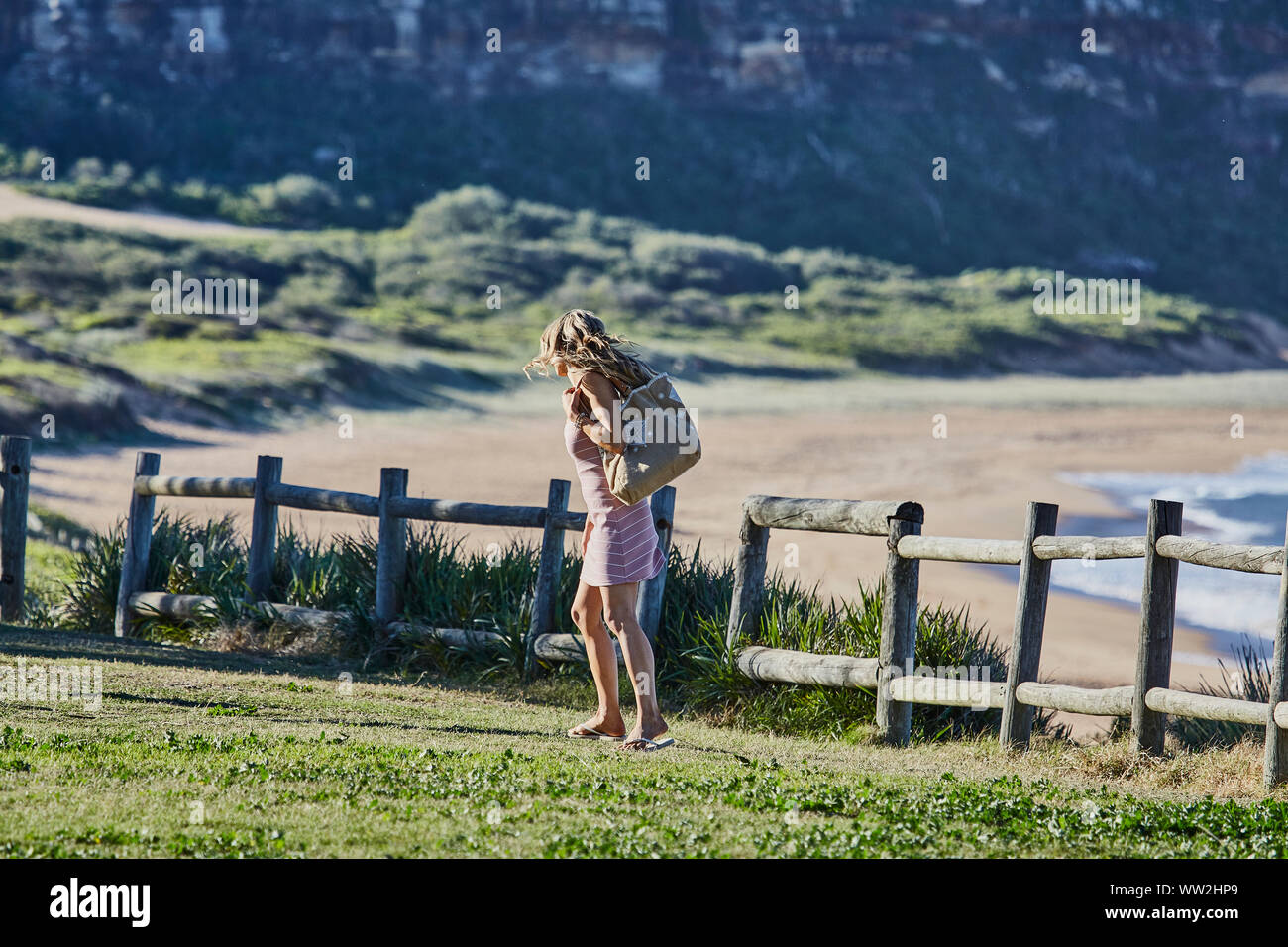 Actors Jake Ryan and Sam Frost prepare to film an outdoor scene of Home & Away tv series at Palm Beach, Australia Stock Photo