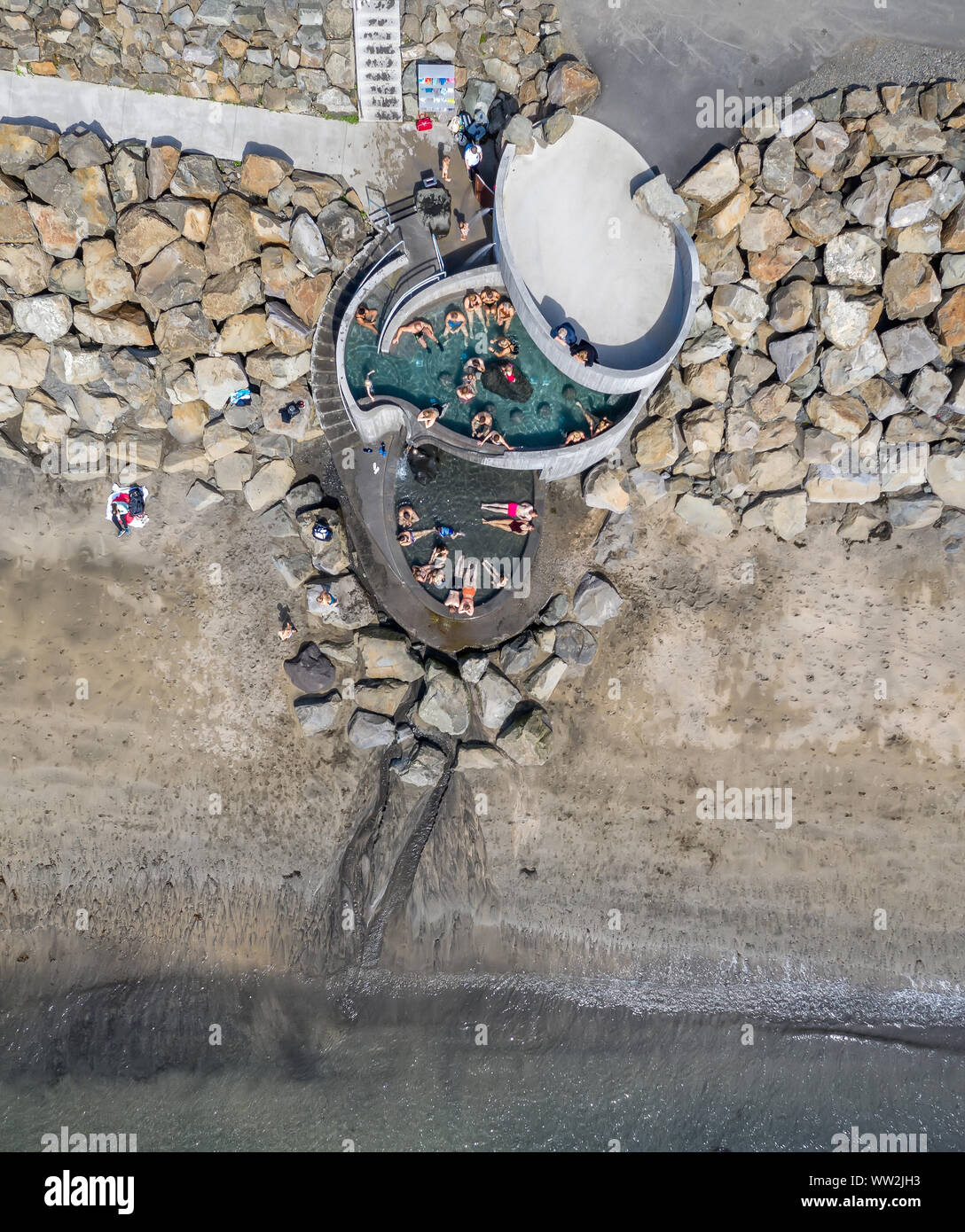 Gudlaug baths, geothermal hot tubes, located on Langisandur, Akranes, Iceland Stock Photo