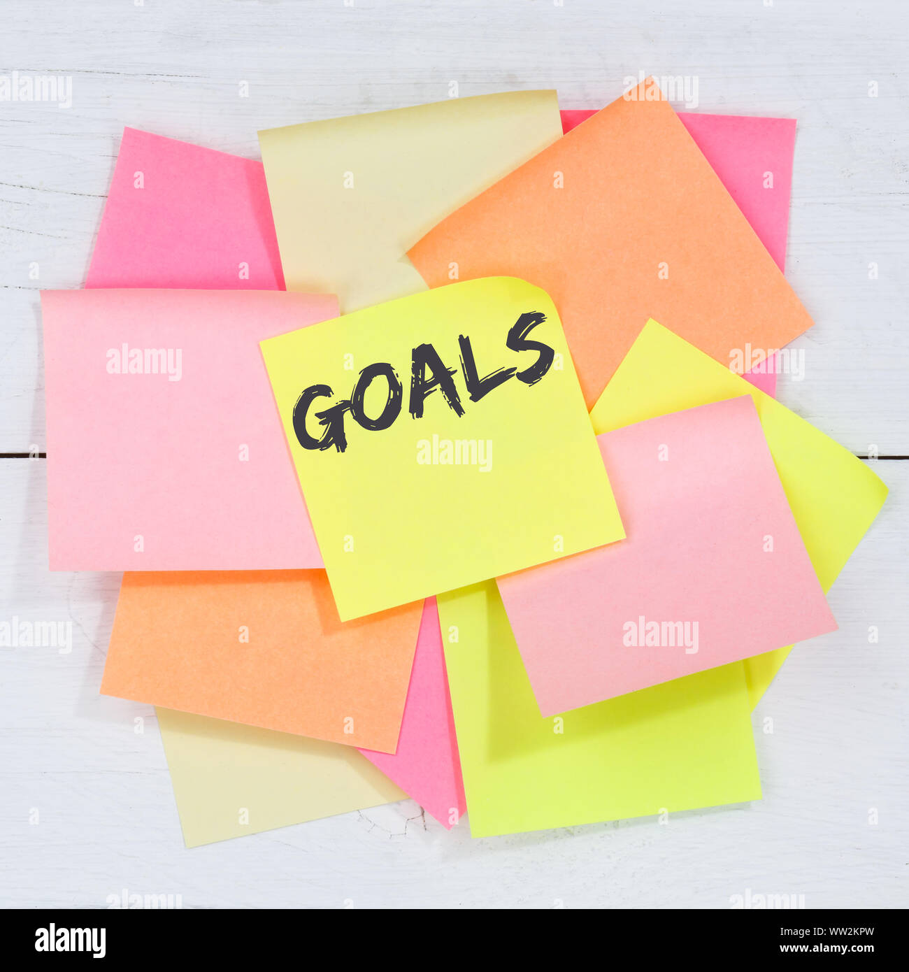 Goal goals to success aspirations and growth business concept desk note