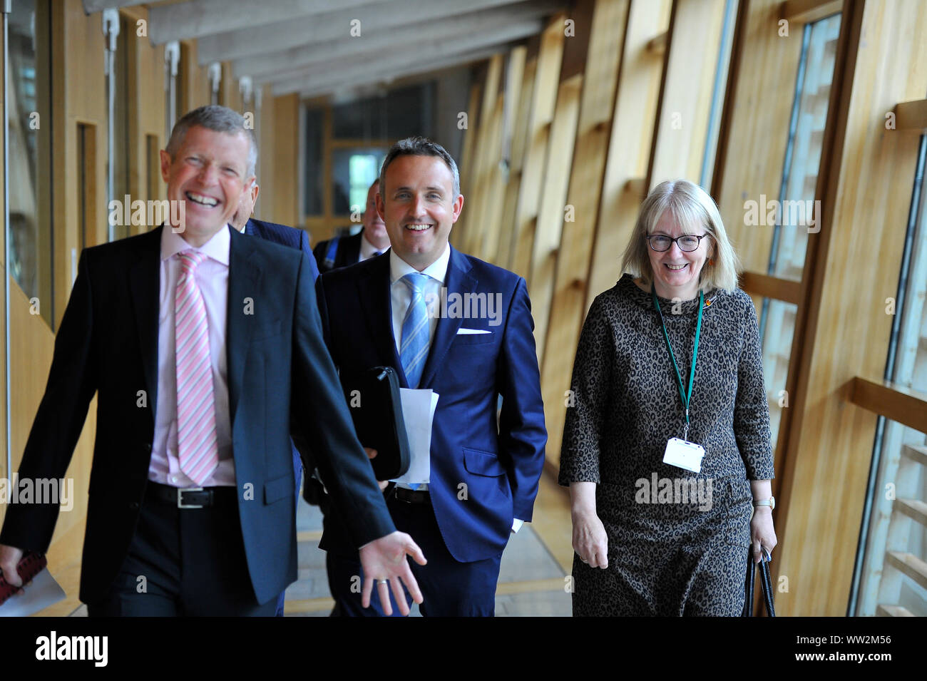Edinburgh, UK. 12th Sep, 2019. Pictured: (left-right) Wilie Rennie MSP - Leader of the Scottish Liberal Democrat Party; Alex Cole-Hamilton MSP; Beatrice Wishart MSP - newly elected MSP for Shetland. First session of First Ministers Questions as the Scottish Parliament tries to steer a path through the fallout of the latest Brexit mess and prevent Scotland from leaving the EU. Credit: Colin Fisher/Alamy Live News Stock Photo