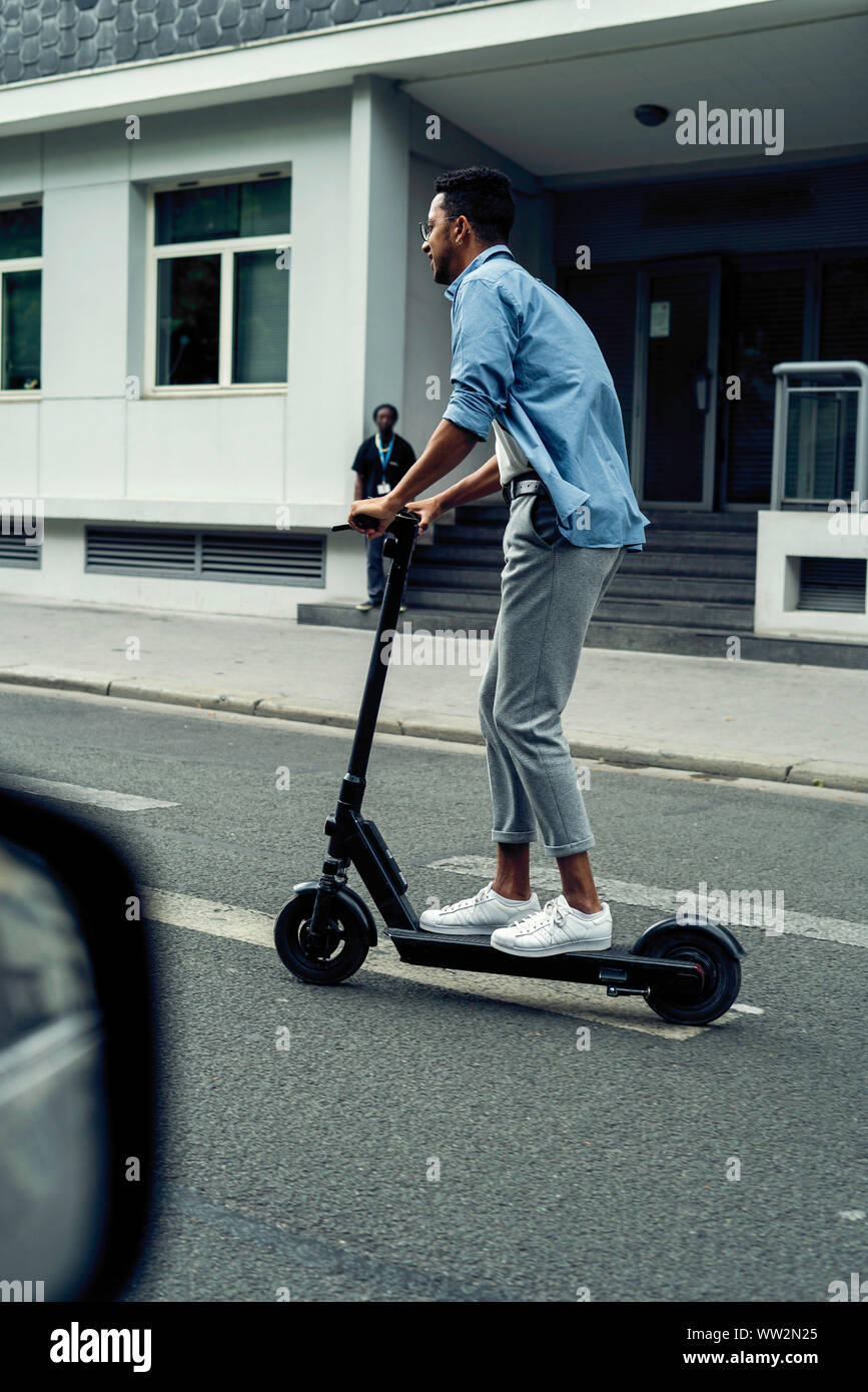 Young man e scooter hi-res stock photography and images - Alamy