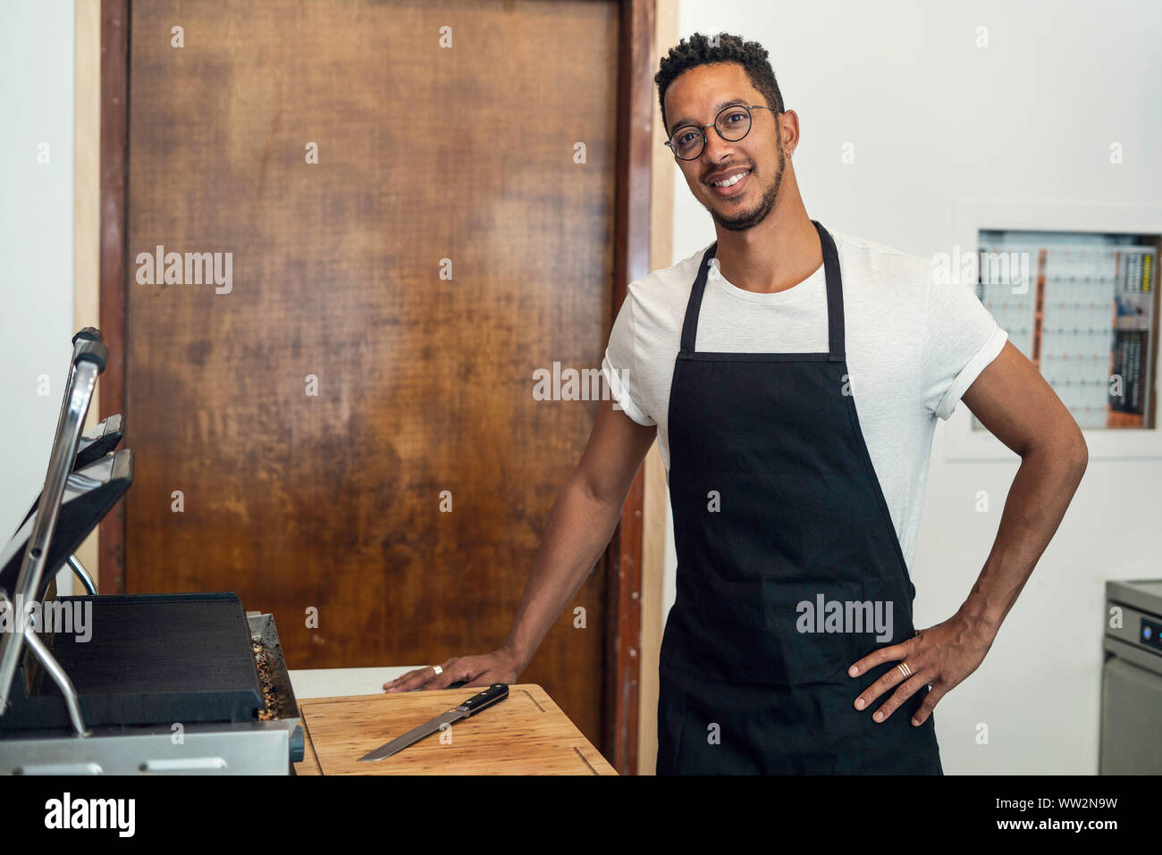 Portrait of man standing in commercial kitchen Stock Photo