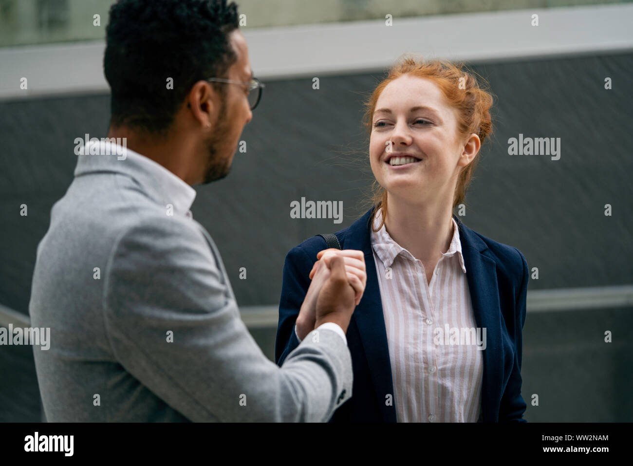 couple holding hands outdoors Stock Photo