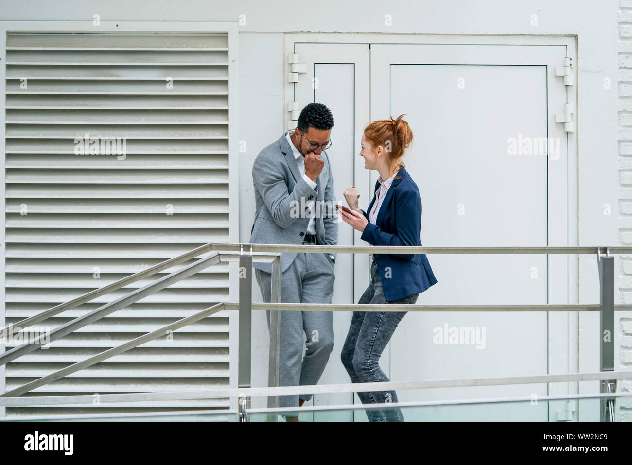 Happy couple standing outdoors Stock Photo