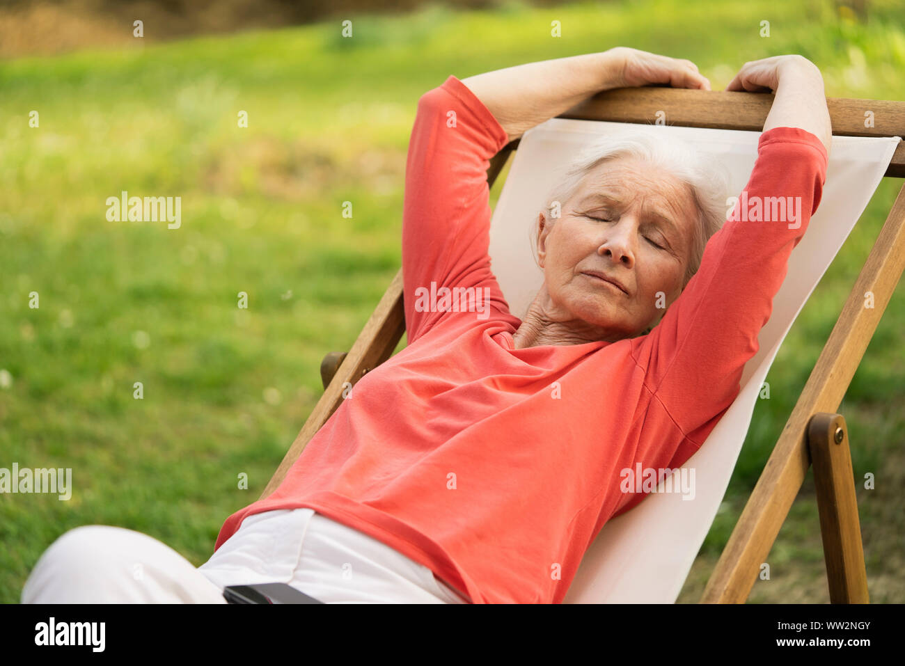 Woman sitting chair eyes closed hi-res stock photography and images - Alamy