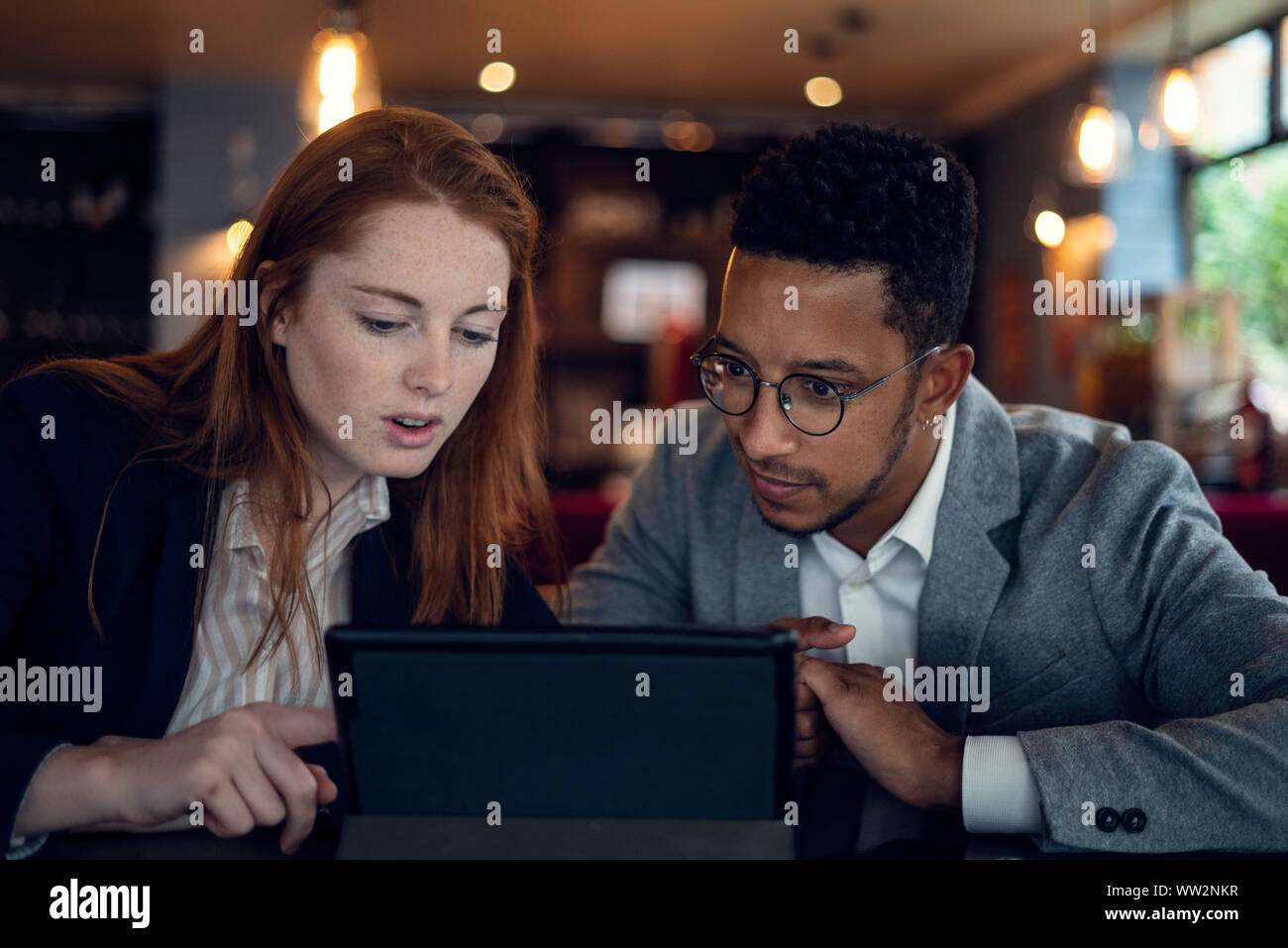 Couple using digital tablet Stock Photo