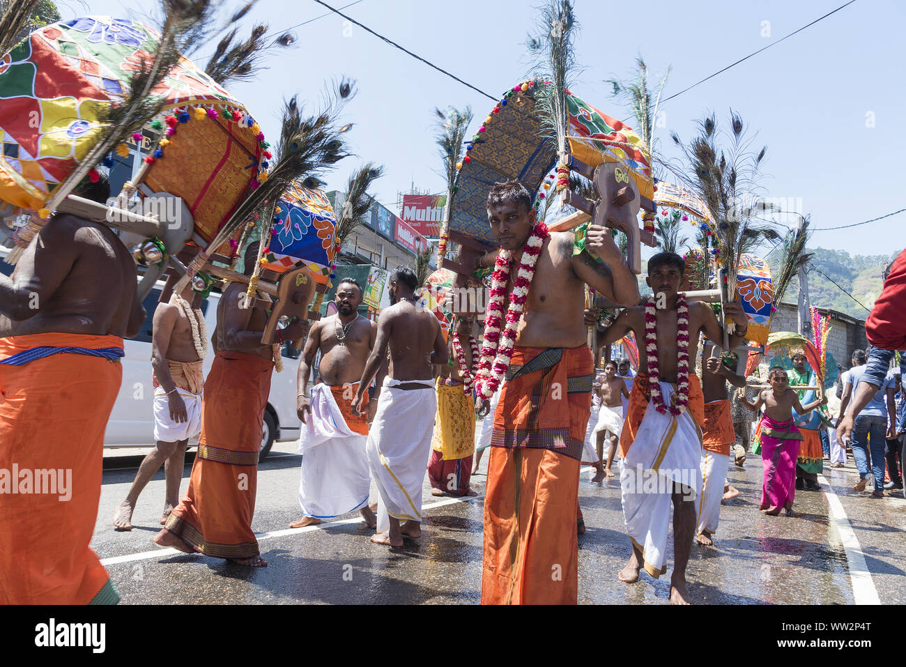 Pussellawa, Sri Lanka,  03/20/2019: Hindu festival of Thaipusam - body piercing rituals under the blood moon. Devotees parading through the town Stock Photo