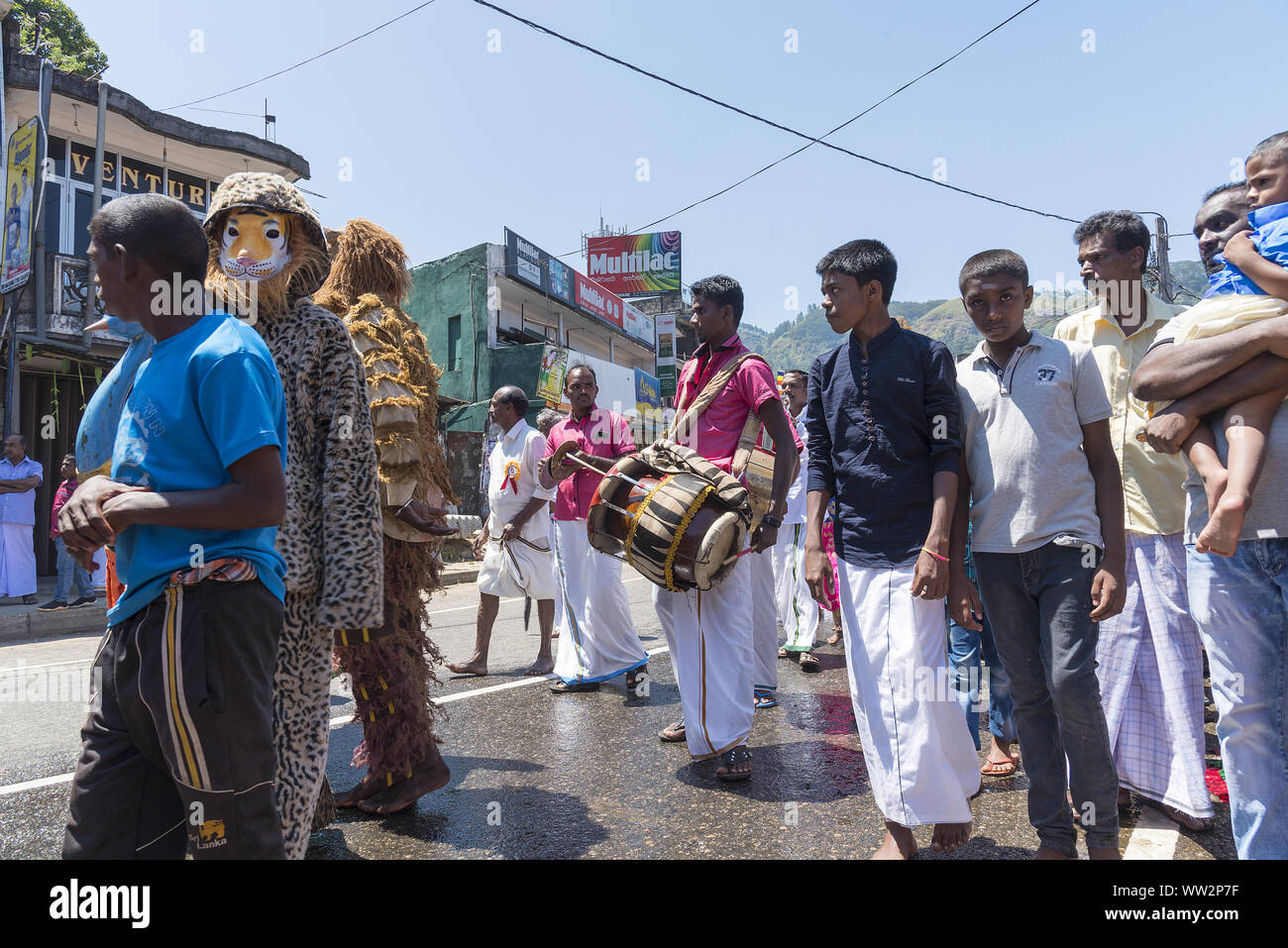 Pussellawa, Sri Lanka,  03/20/2019: Hindu festival of Thaipusam - body piercing rituals under the blood moon. Musiciansin traditional costume Stock Photo
