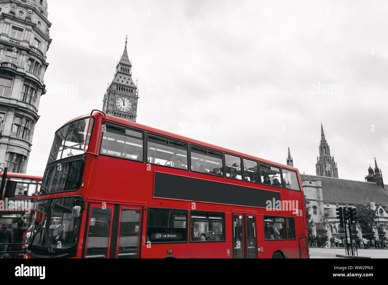 Classic red double-decker British bus, circulating through the center ...