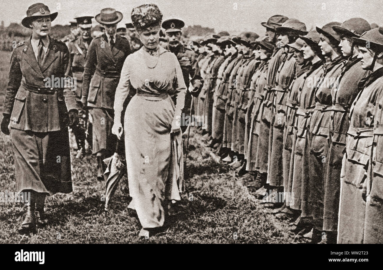 Queen Mary inspecting the W.A.A.C's (Women's Auxiliary Army Corps) at Aldershot in 1916 during WWI.  Mary of Teck, 1867 – 1953. Queen consort of the United Kingdom as the wife of King George V.  From The Pageant of the Century, published 1934. Stock Photo