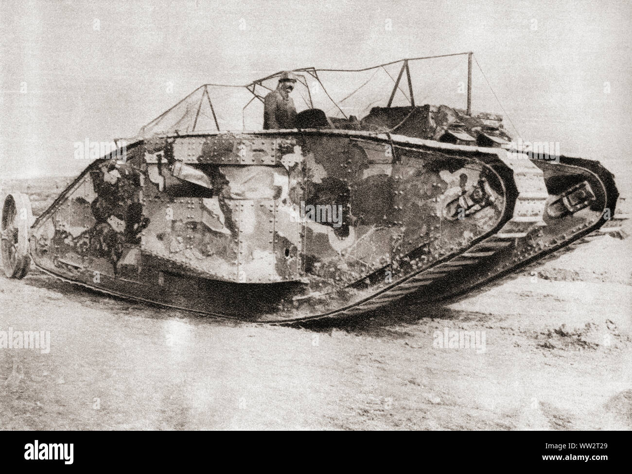 A British Mark I tank in action at the Battle of Flers-Courcelette, fought during the Battle of the Somme in France in 1916 during WWI.  From The Pageant of the Century, published 1934. Stock Photo