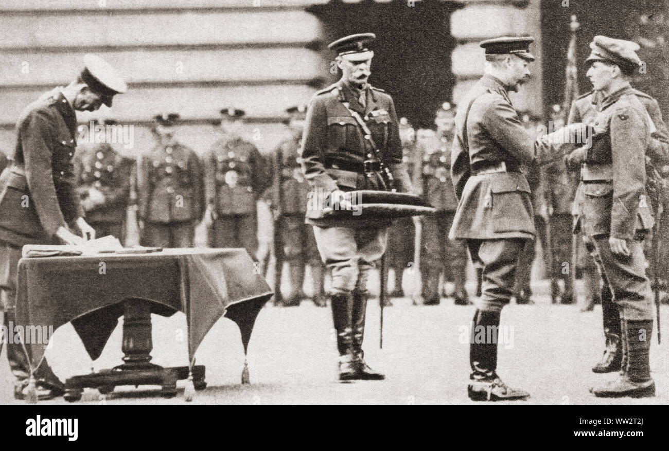 King George V awarding a soldier the Victoria Cross, Britain's highest honour to courage, during WWI.  From The Pageant of the Century, published 1934. Stock Photo