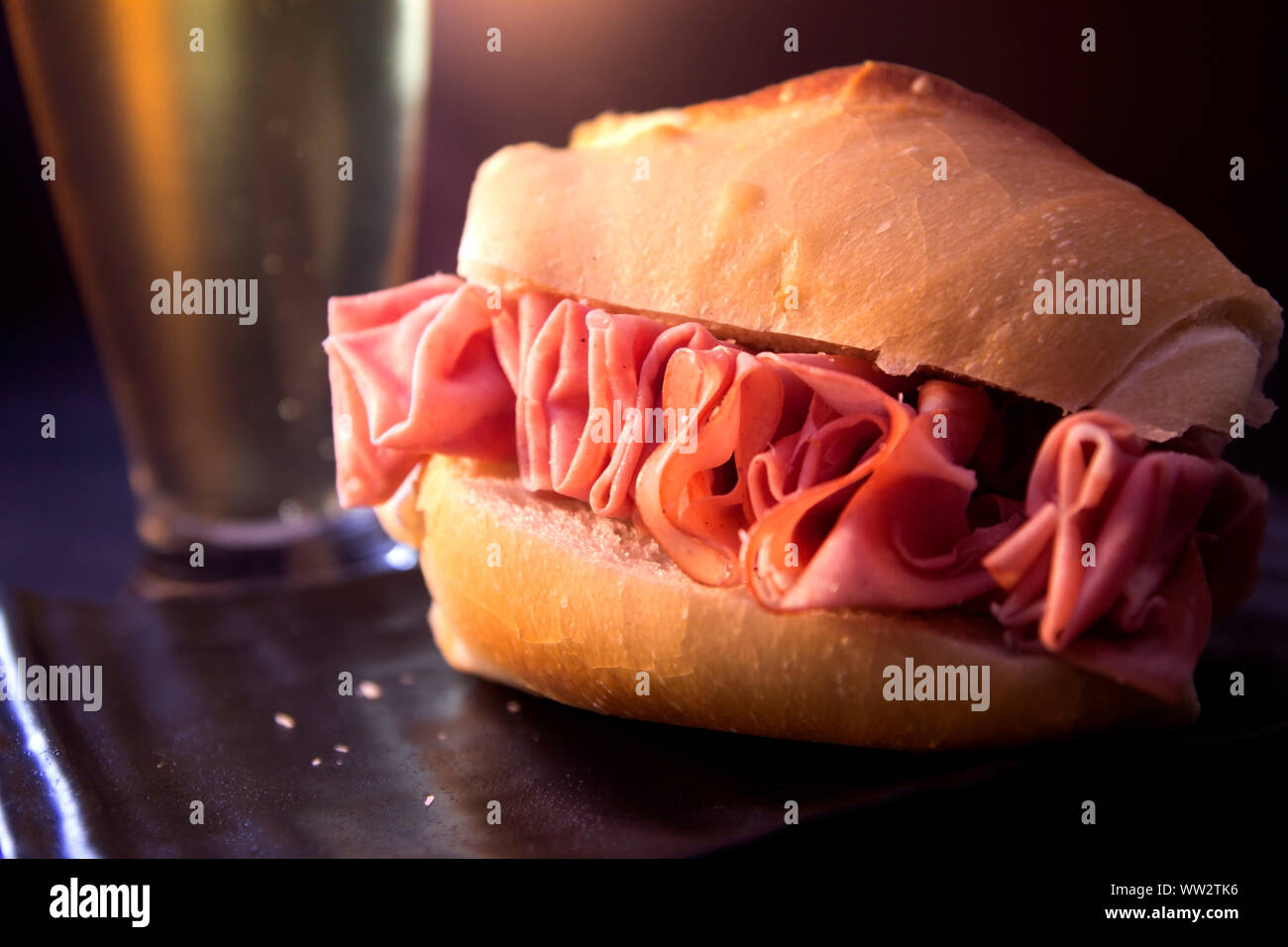 Mortadella sandwich on dark background. Traditional food of Sao Paulo