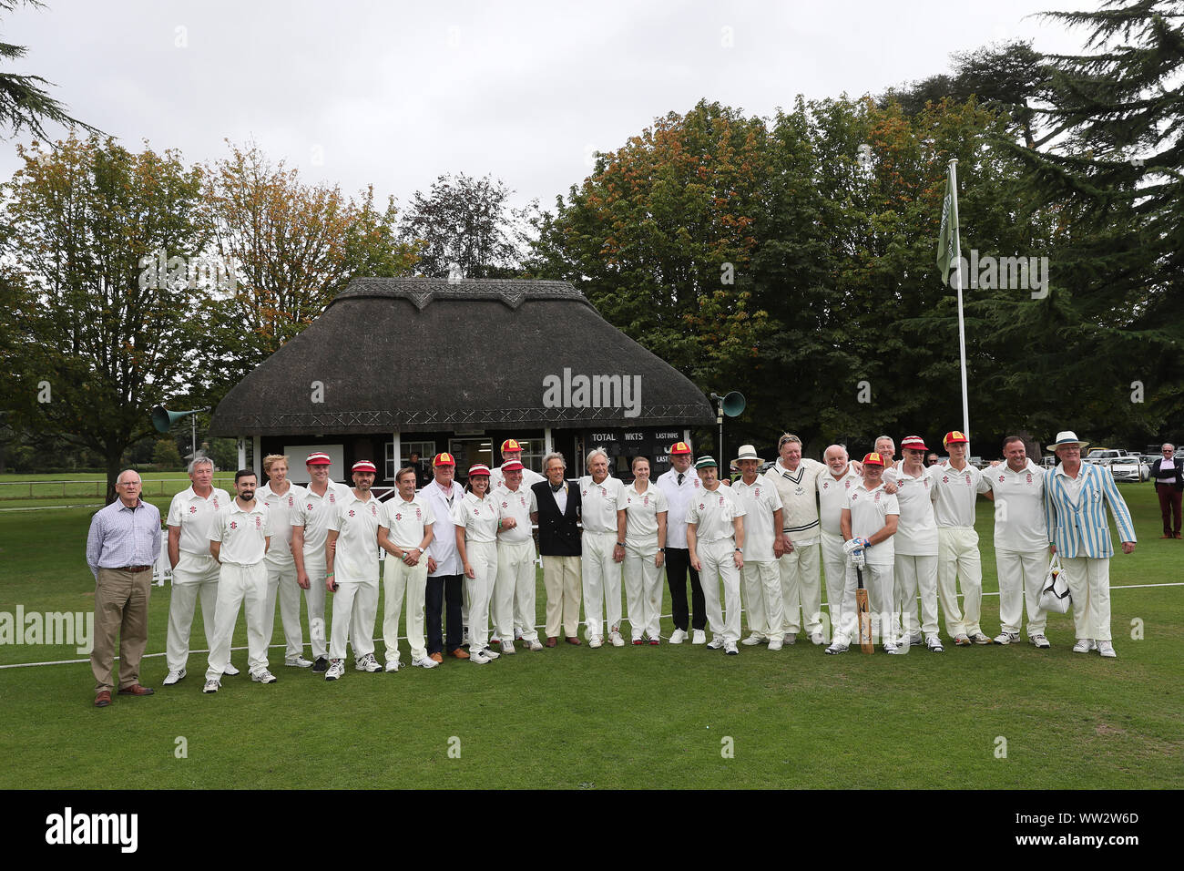 Goodwood, West Sussex, UK. 12th Sep, 2019. The Goodwood Revival cricket matchs teams pose for a photo with the Duke of Richmond & Gordon. The teams include many famous drivers such as Derek Bell, Brendon Hartley, Stuart Graham and are called the Duke of Richmond & Gordon's XI and the Earl of March & Kinrara's XI at the Goodwood Revival in Goodwood, West Sussex, UK. Credit: Malcolm Greig/Alamy Live News Stock Photo