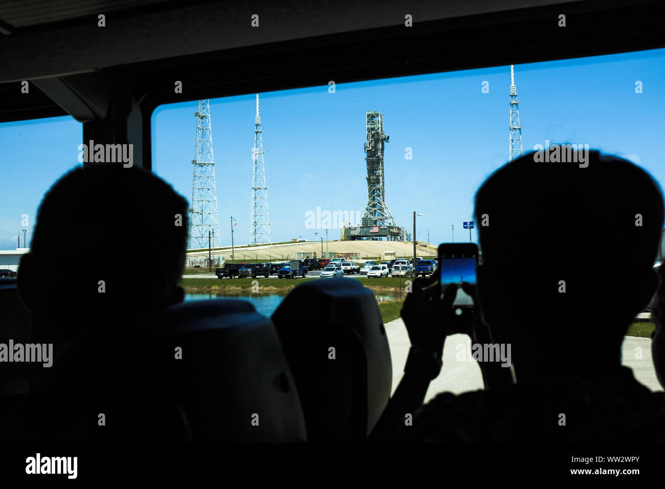 Visitors viewing the NASA Kennedy Space Center launchpad from the NASA tour bus. Florida, USA Stock Photo