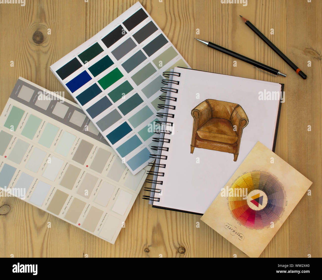 Flat lay of Interior designer work space with sketches, tools and colour charts Stock Photo