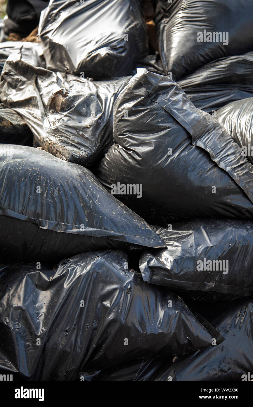 Black Bags of Rubble Stock Photo