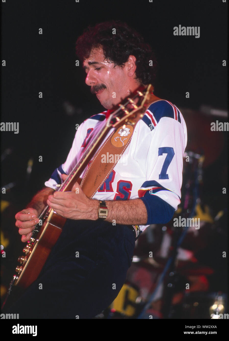 Carlos Santana plays guitar onstage at the Palladium in New York in November 1979. Stock Photo