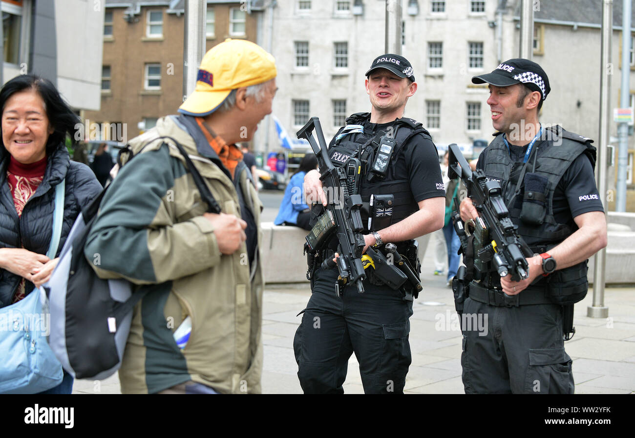 JON SAVAGE PHOTOGRAPHY 24TH   MAY  2017  Armed police officers patrol the Scottish Parliament in Edinburgh as security is increased across the city. Stock Photo